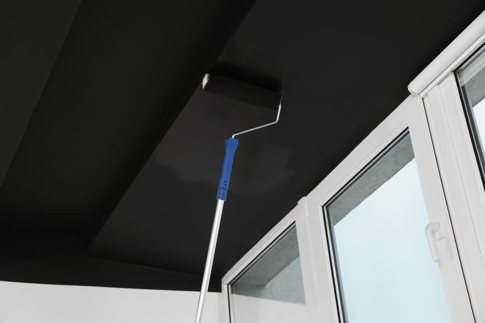 A view of black roller paint on a ceiling