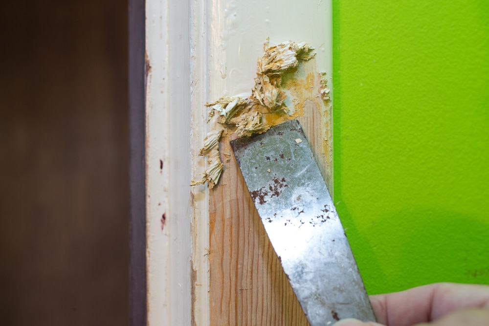 A view of paint being stripped off a wall