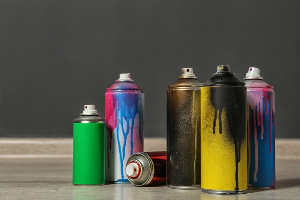 A view of used spray paint cans