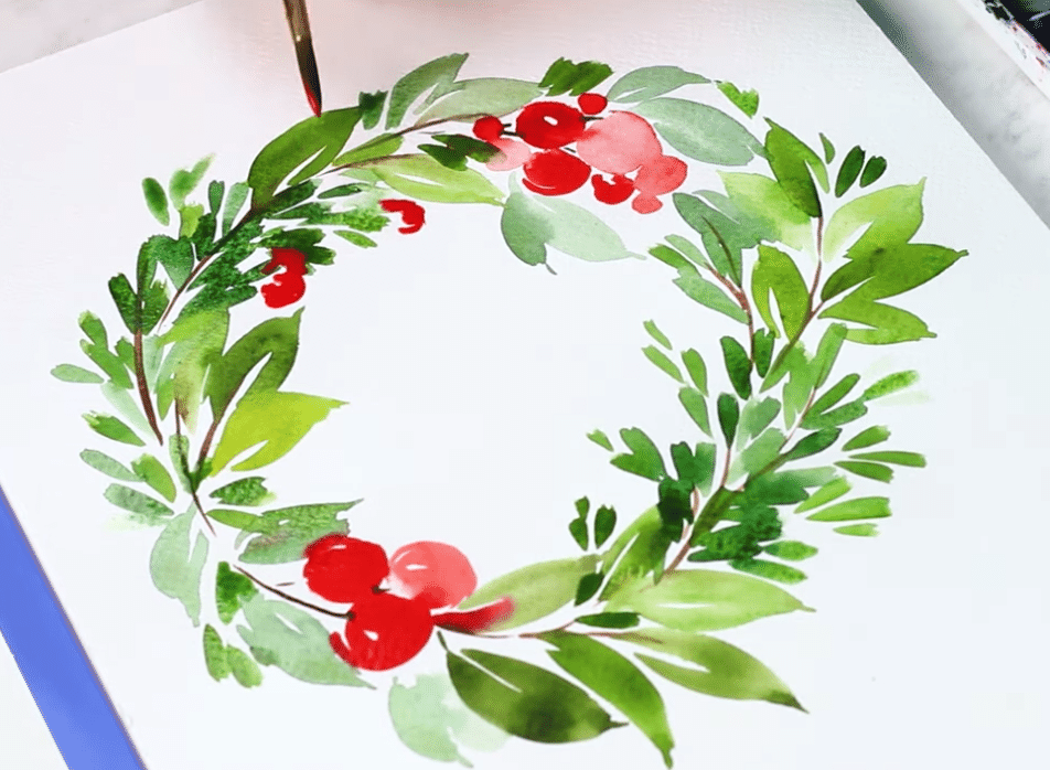 A Christmas wreath painted with water colors