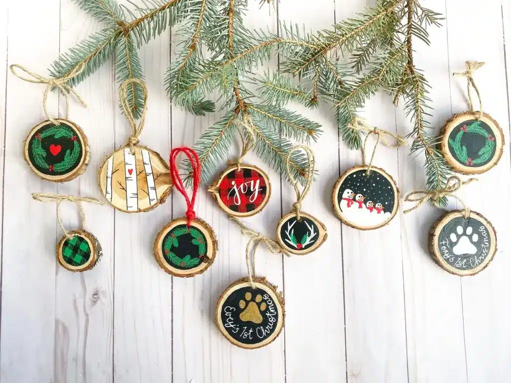 Christmas Wooden Slice Ornaments hung on a fence