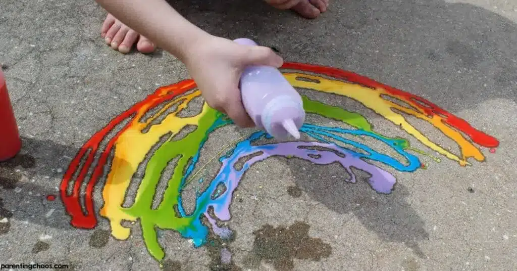 rainbow painting using sdewalk chalk paints