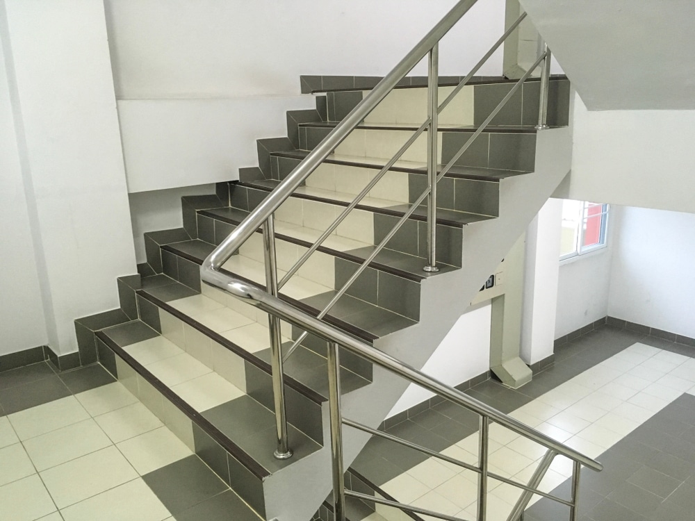 Two Color Staircase Has Gray Aluminium Handrail At Apartment