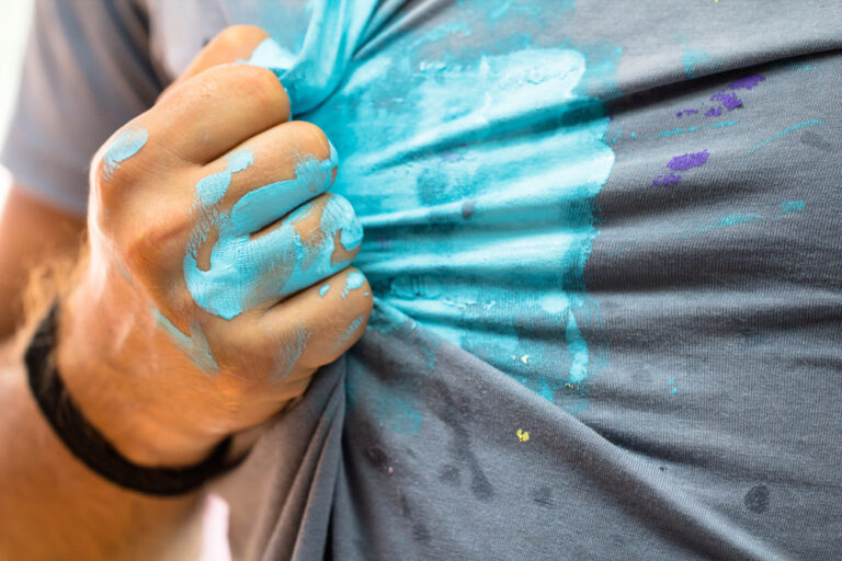 Man Hand and shirt Stained By A Blue Paint