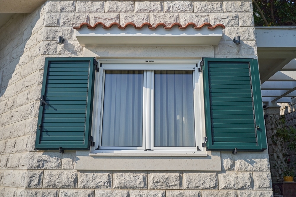 White Window In A House With Open Plastic Shutters