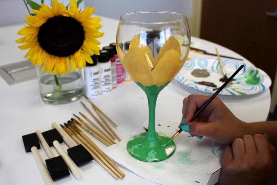 a painter painting a wine glass