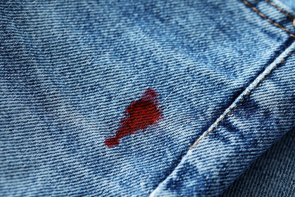 Stain Of Red Ink On Jeans Closeup