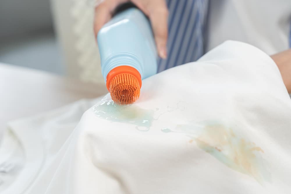 Housewife Woman Removing paint Spill From