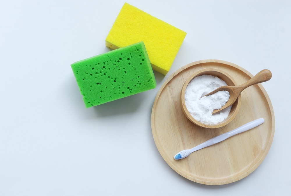 Baking Soda (sodium Bicarbonate) In Wooden Bowl Toothbrush And Sponges