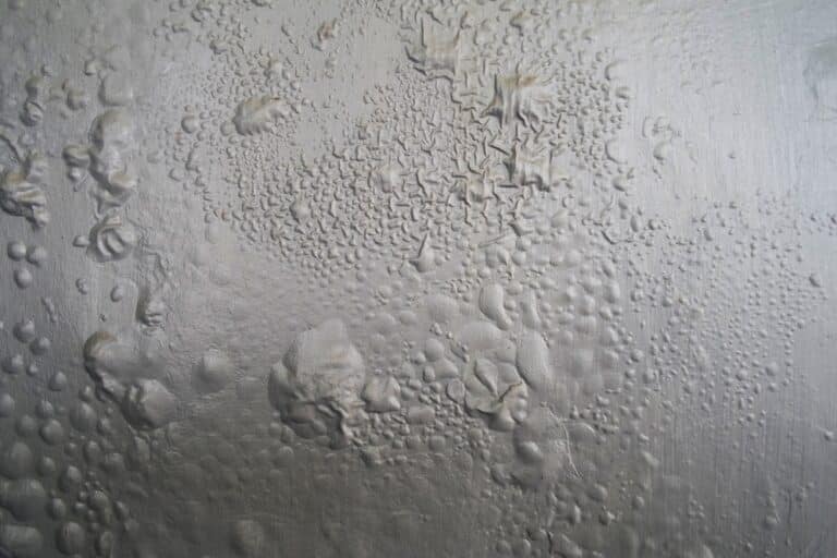 The Gray Wall Paint Bubbled Because Of The Humid Air