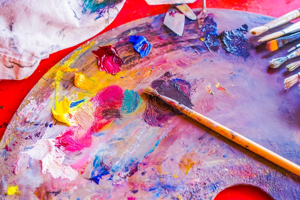 Background Image Of Bright Mixed Color Paints On Art Palette