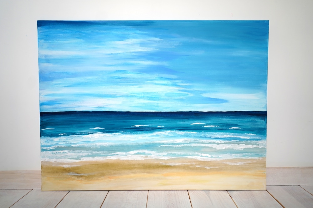 A view of a painting of the sea and beach