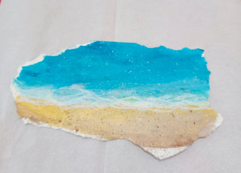 A view of a piece of paper with beach painting