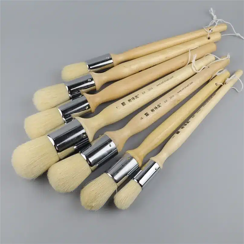 set of round brushes on grey background set of round brushes on grey background