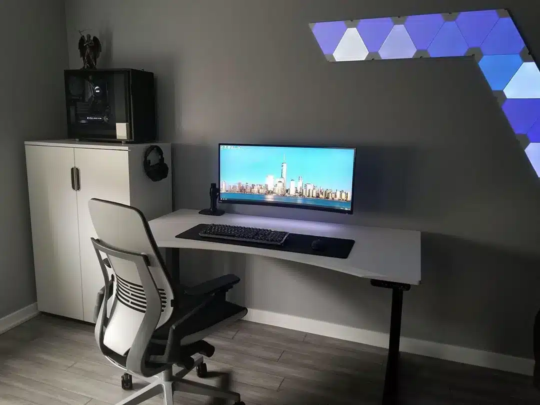 charcoal walls in a gaming room ergonomic chair and gaming pc