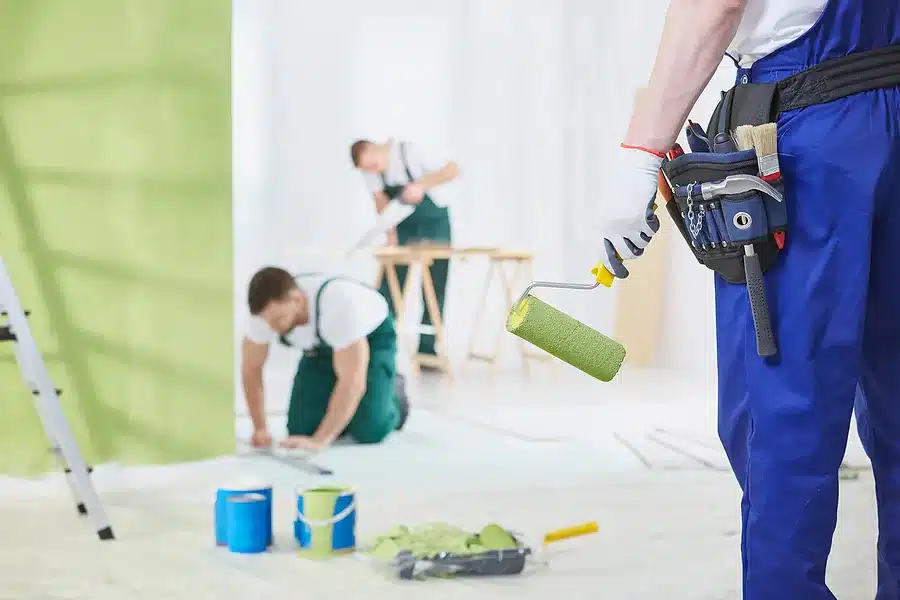 zoom in view of a professional painter holding a roller