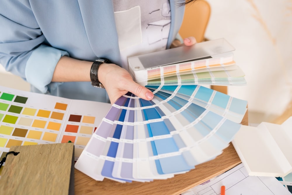 Close up Of Architect Woman Choosing Samples Of Wall Paint Interior Close up Of Architect Woman Choosing Samples Of Wall Paint Interior