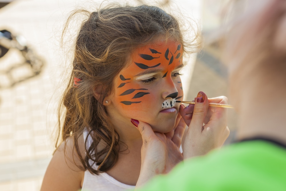 Girl Getting Her Face Painted By Painting Artist Outdoor Children Girl Getting Her Face Painted By Painting Artist