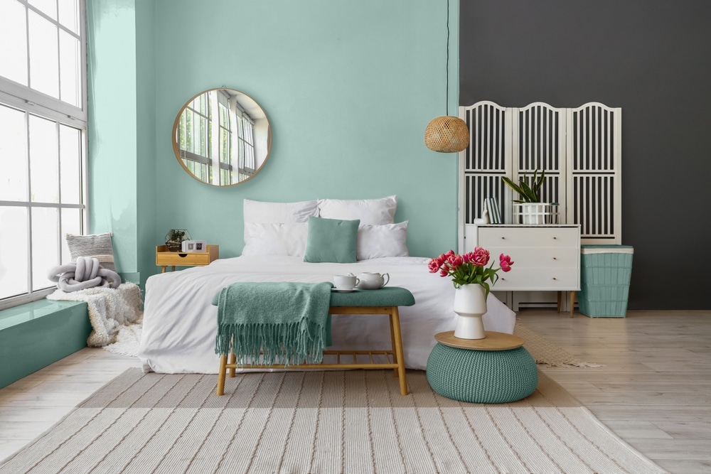 Interior Of Modern Bedroom With Painted Wall And Big Mirror Interior Of Modern Bedroom With Painted Wall And Big Mirror
