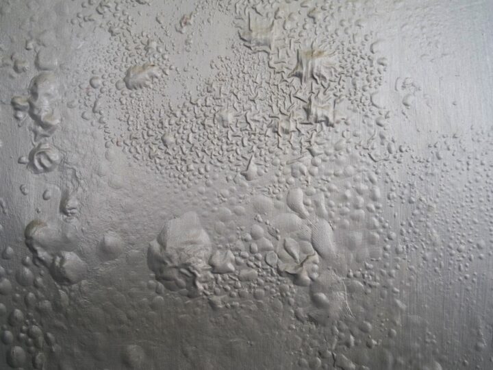 The Gray Wall Paint Bubbled Because Of The Humid Air
