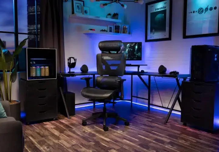 a gaming room with pc setup ergonomic chair and blue neon lights