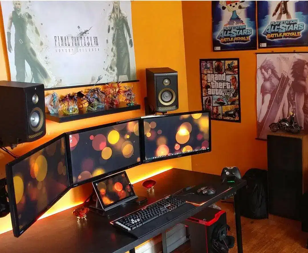 burnt orange walls in a room with gaming pcs and artwork displayed on walls burnt orange walls in a room with gaming pcs and artwork displayed on walls