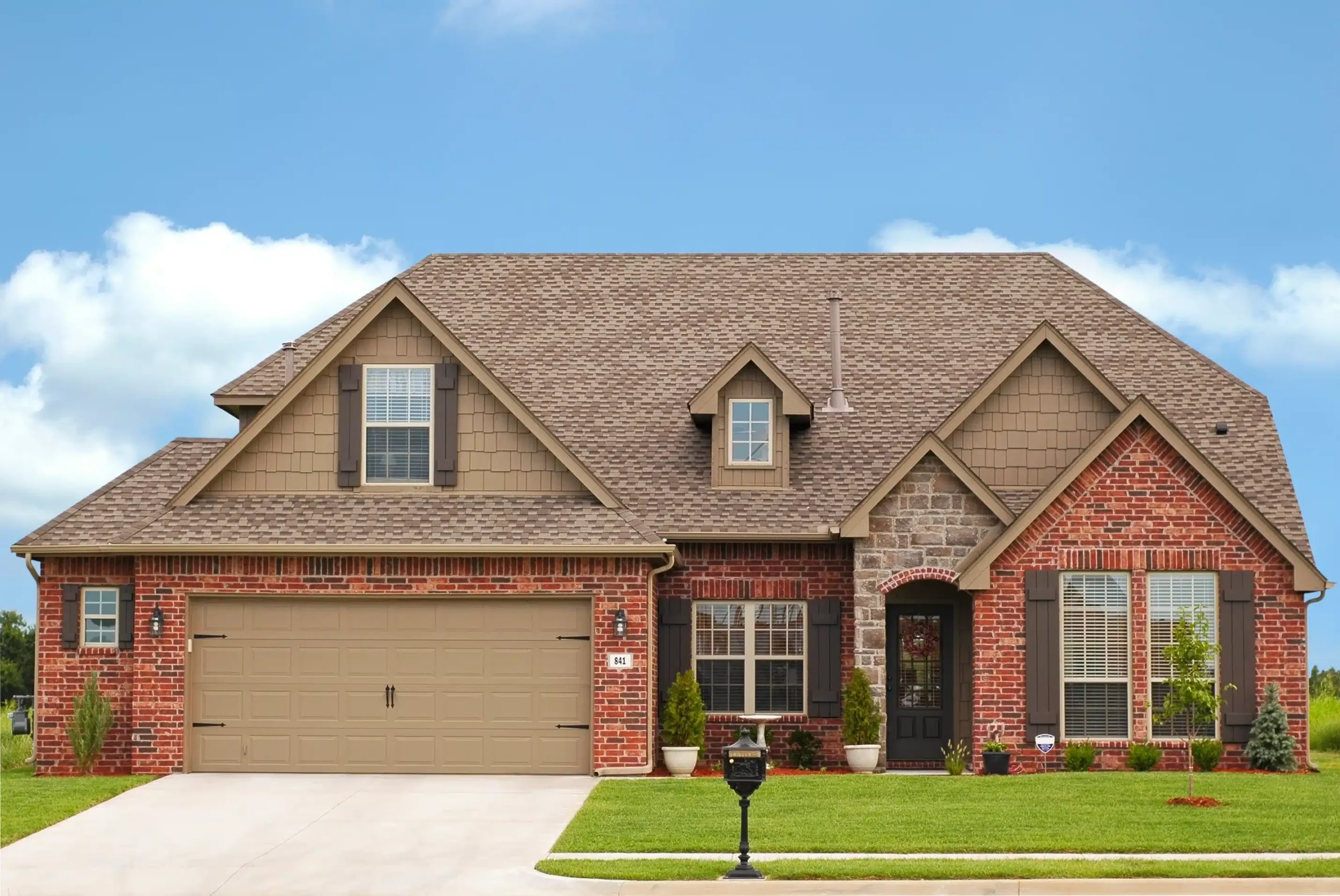 chestnut colored roof on a red brick house