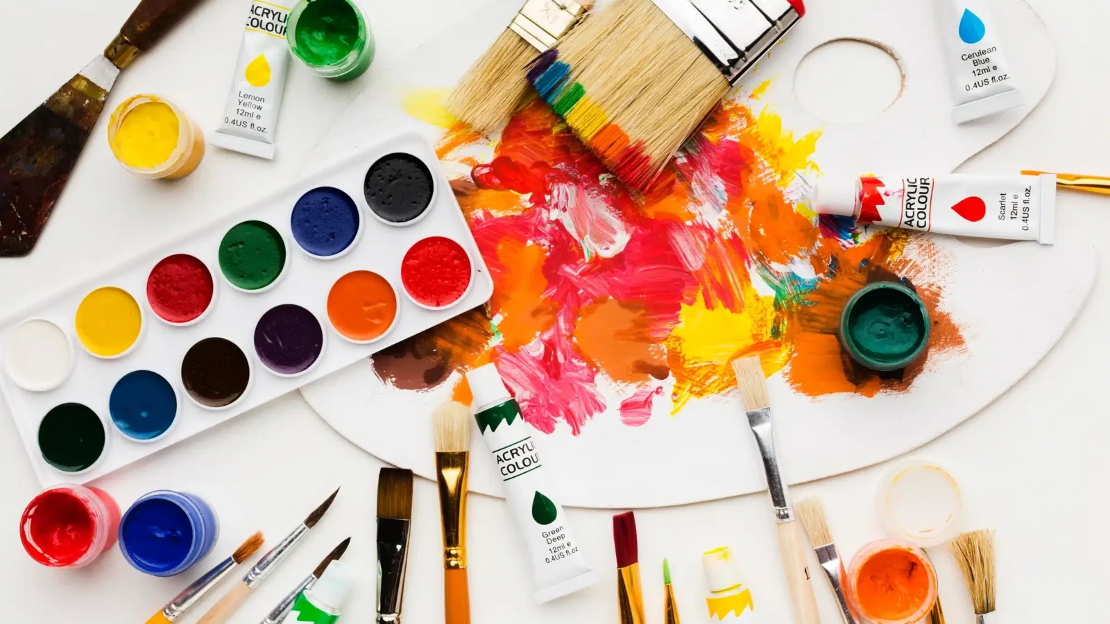 different paint colors and a painting board on a table