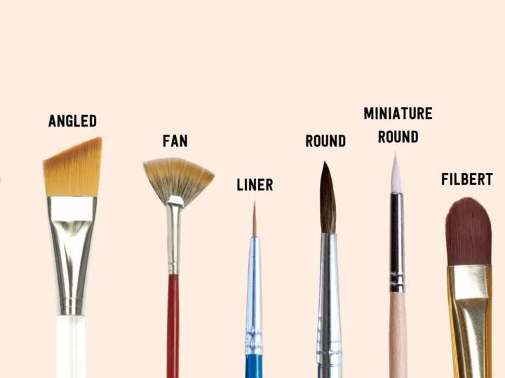different types of paint brushes isolated on a light background