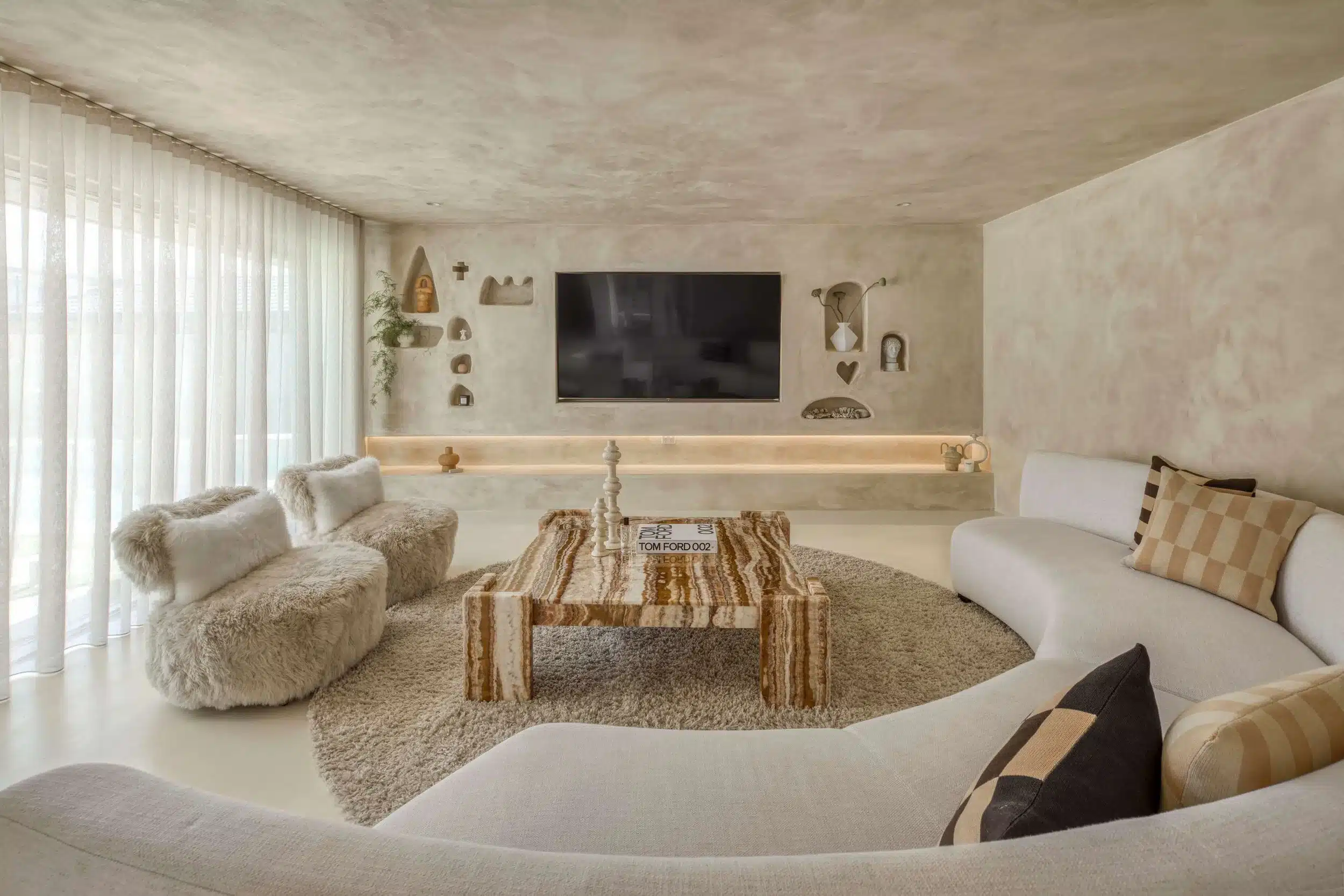 venetian plaster in beige and golden combination in a trendy living room venetian plaster in beige and golden combination in a trendy living room
