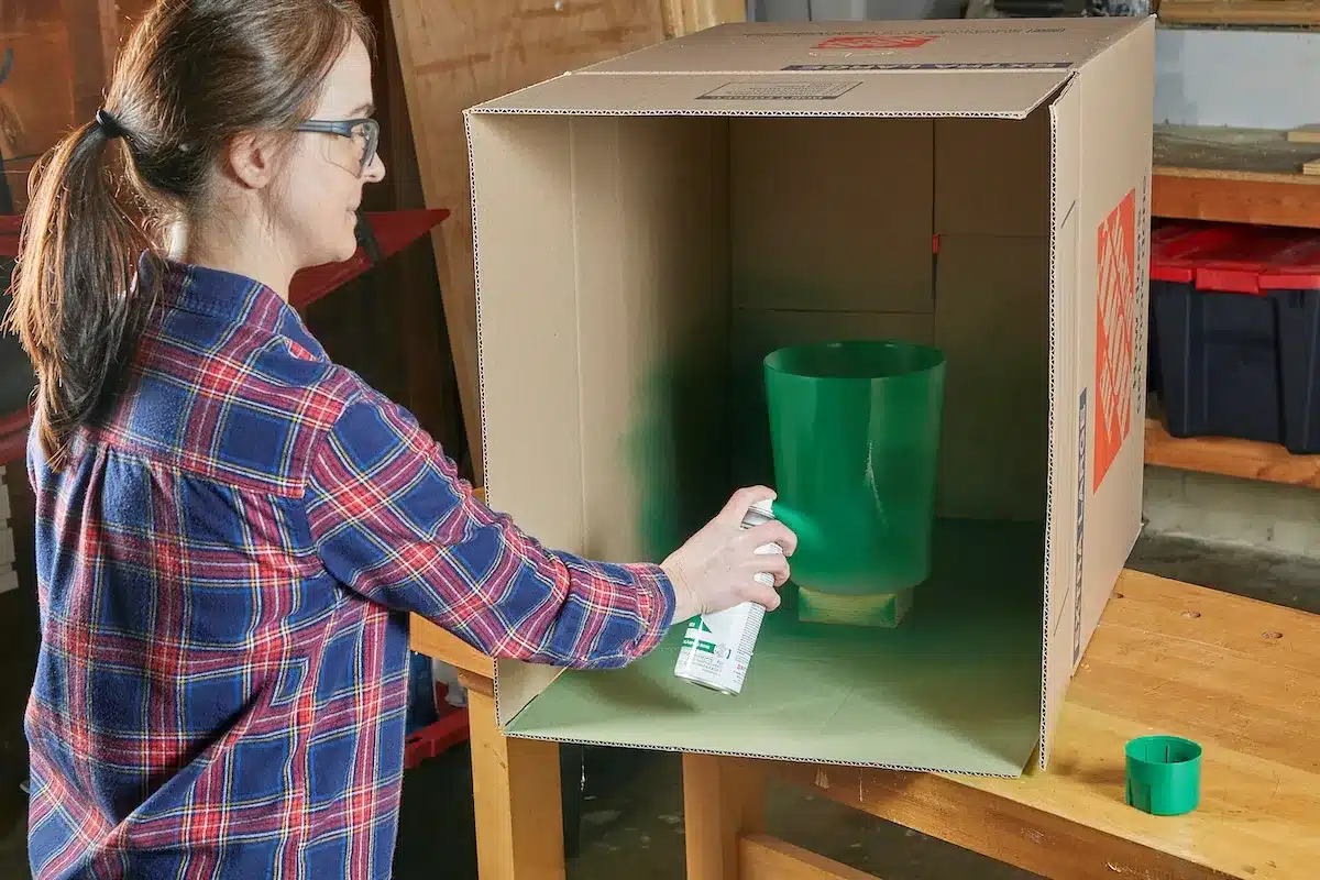 view of a woman painting a plastic view of a woman painting a plastic
