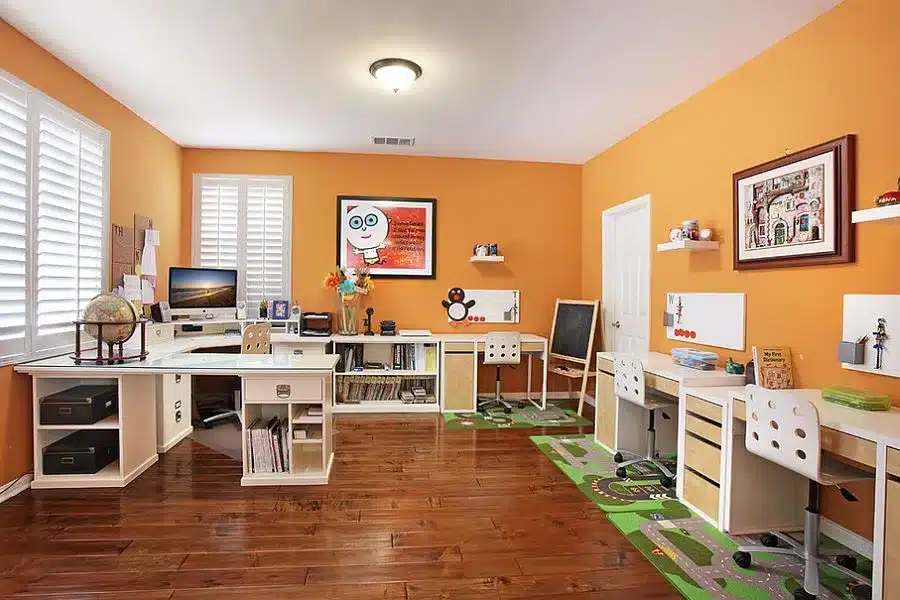 view of an orange office space with systems and setup view of an orange office space with systems and setup